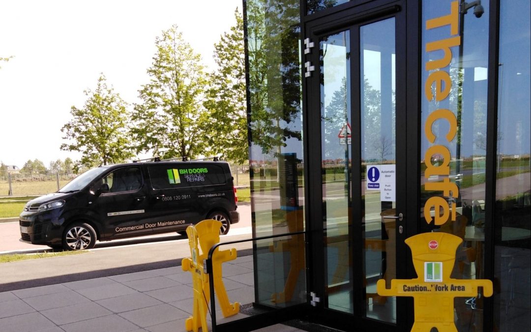 Commercial swing door with barrier