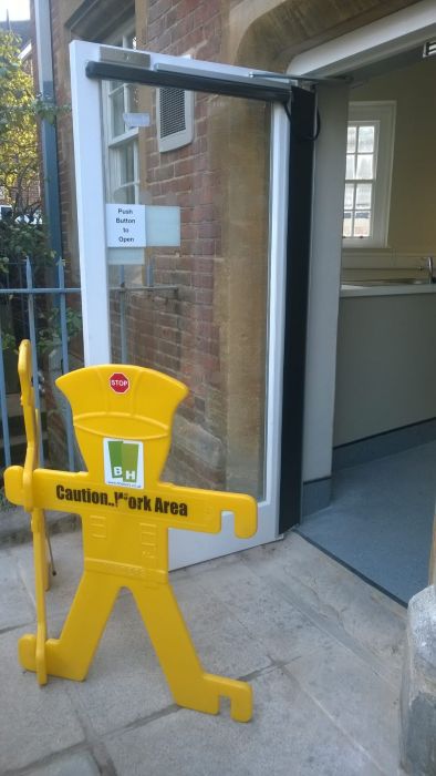 Compliane barriers for safety at commercial swing door